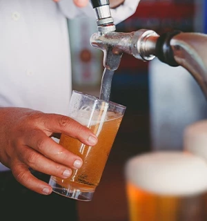 beer tap pouring into a glass