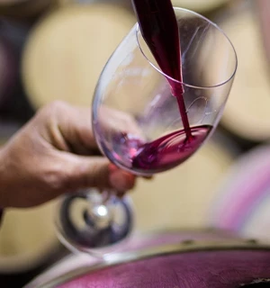 Red wine poured into glass